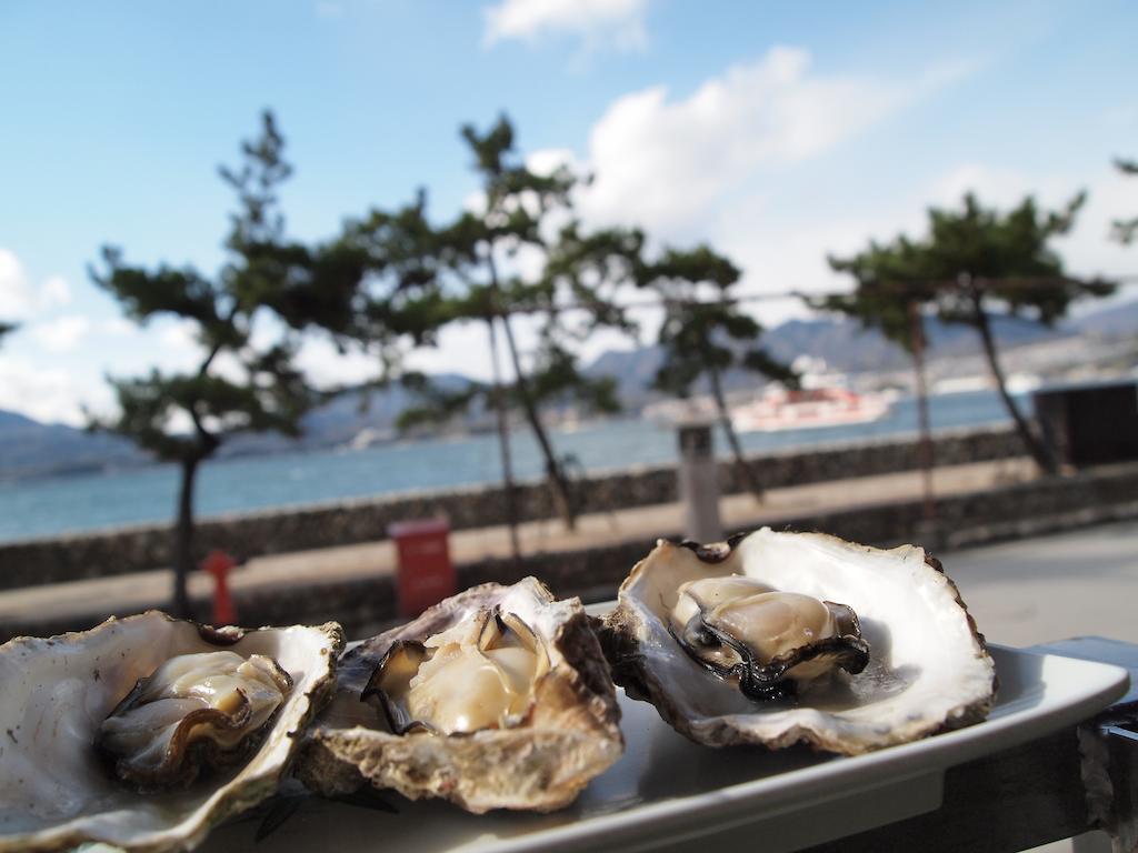 Sakuraya Hotel Hatsukaichi Bagian luar foto